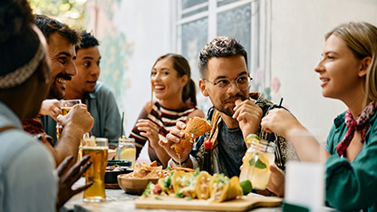 happy group of people in restaurant