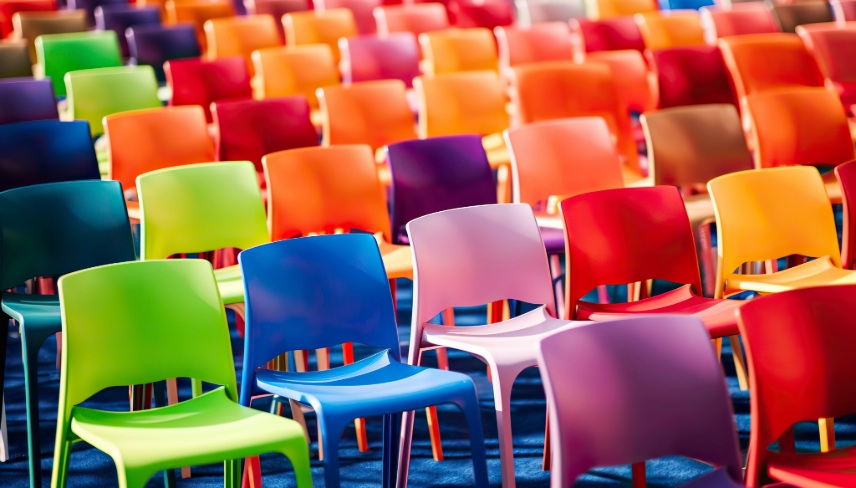 Rows with many colorful, plastic chairs and armchairs.