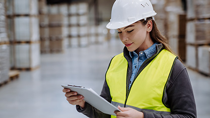 Worker with PPE in warehouse environment