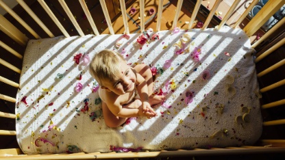 baby lying in crib