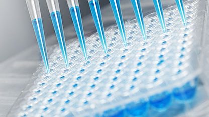 Blue liquid in a test tube, symbolizing advanced analytics for hyaluronic acid in cosmetics and dermal aesthetic devices