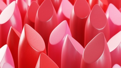 A close up of a group of lipsticks of many shades of pink and rose colours, symbolising beauty and personal care product testing and analysis by Intertek