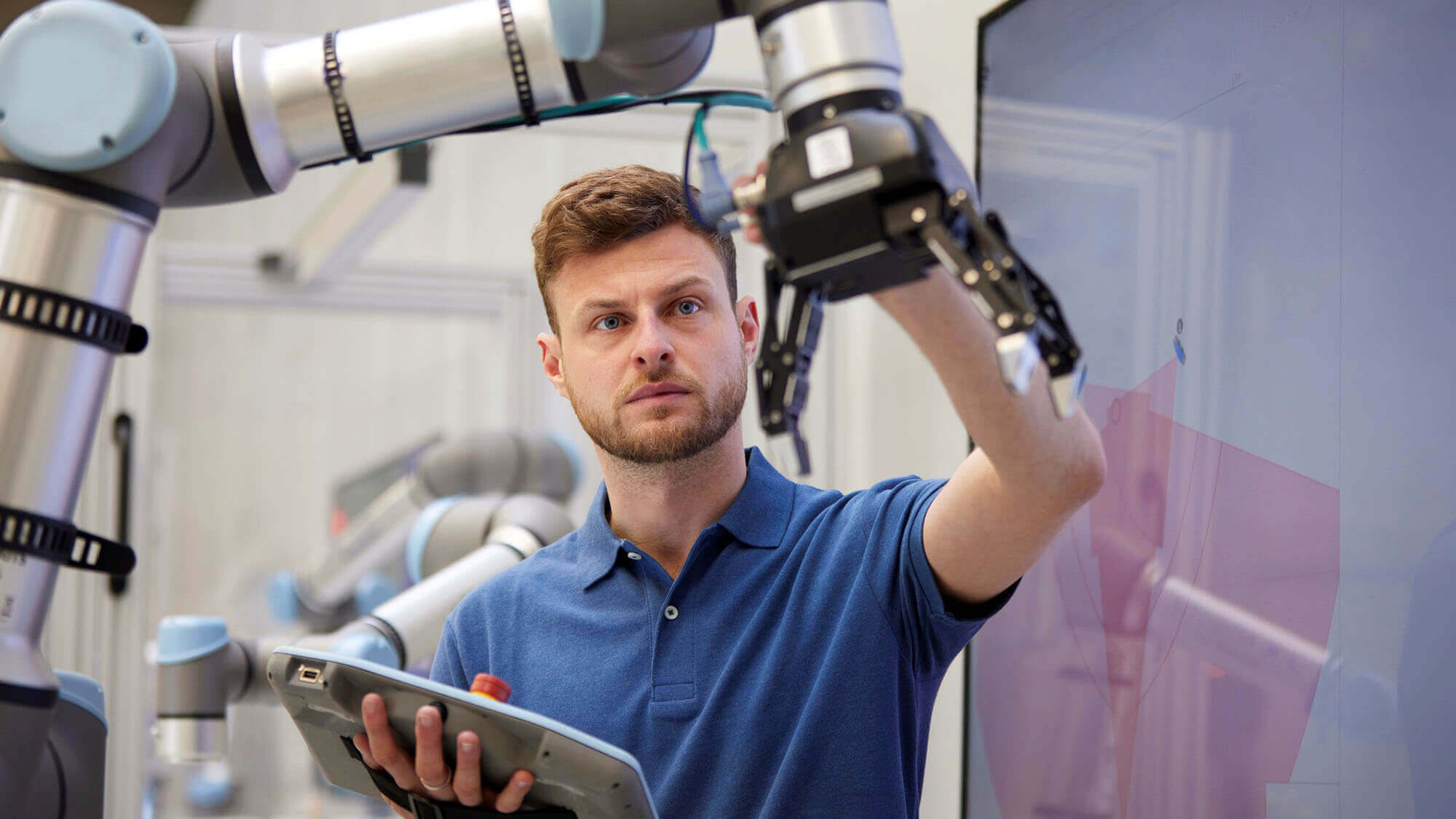 Focused engineer checking machine part holding equipment in industry