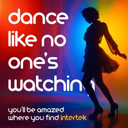 Woman in silhouette dancing with background lit by colorful lighting